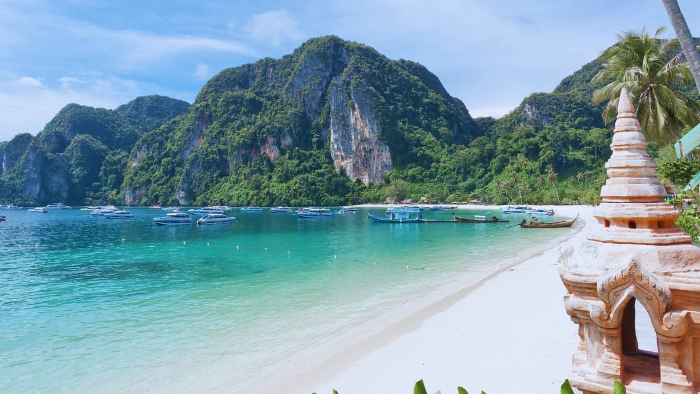 Day trips bring boats of snorkelers and divers to beautiful phi phi