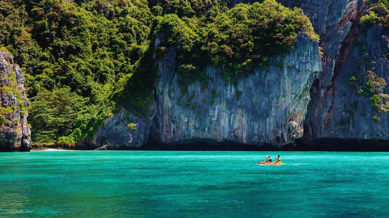 Canoe or kayak the clear turquoise waters around the phi phi islands