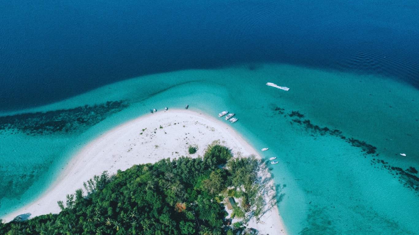 Aerial view of bamboo island's white sand beaches and turquoise waters