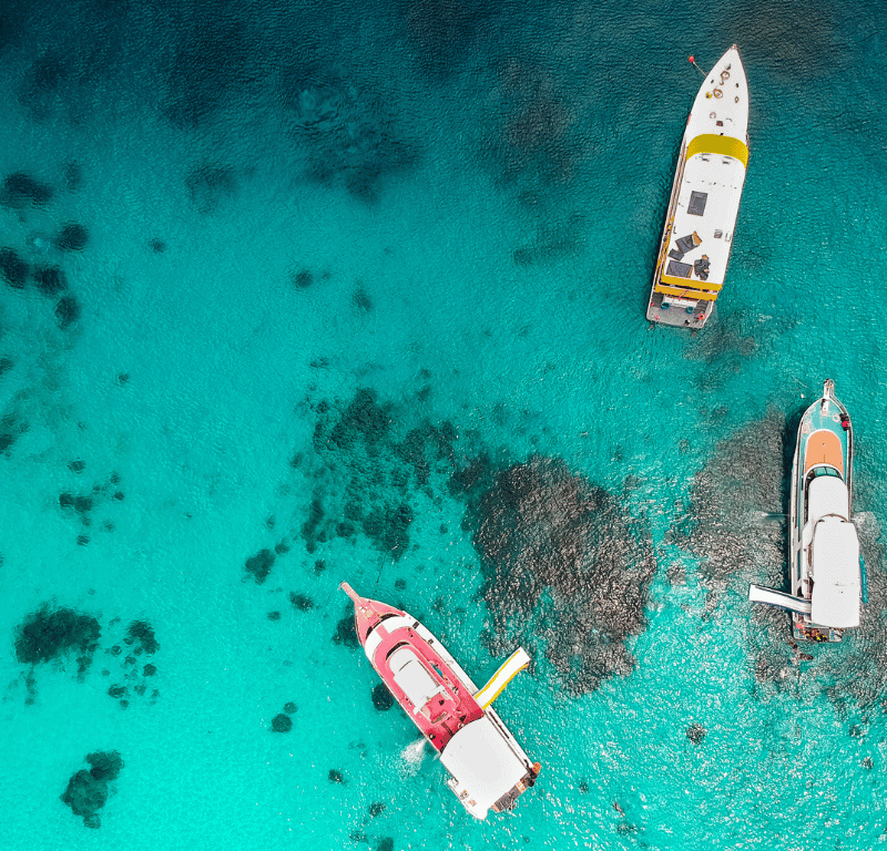 Boats with the reef under them