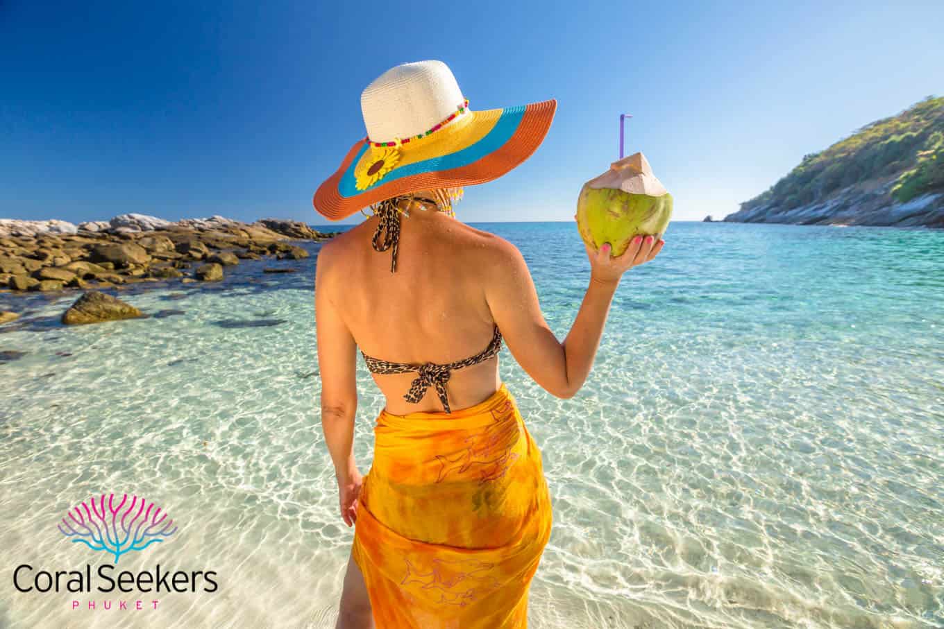 Racha noi island tour lady with coconut on beach