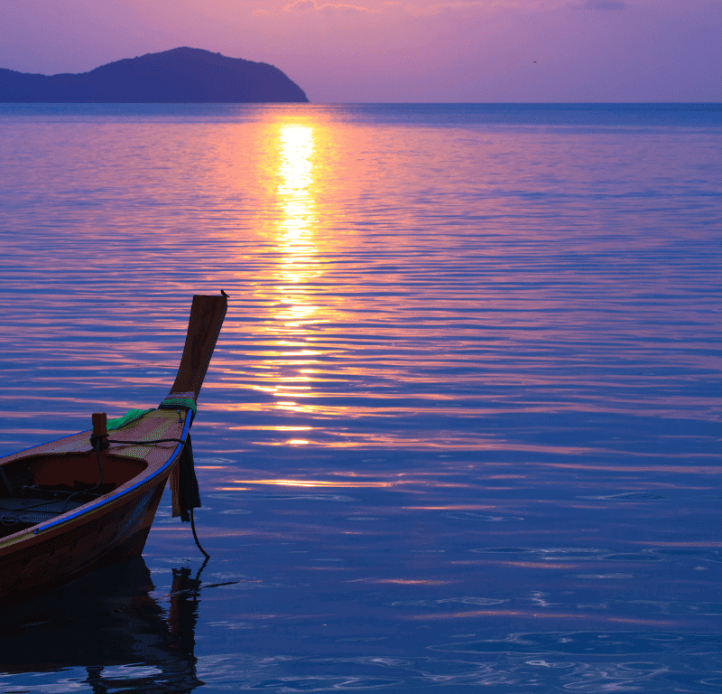 Long-tail boat on mooring sunrise.