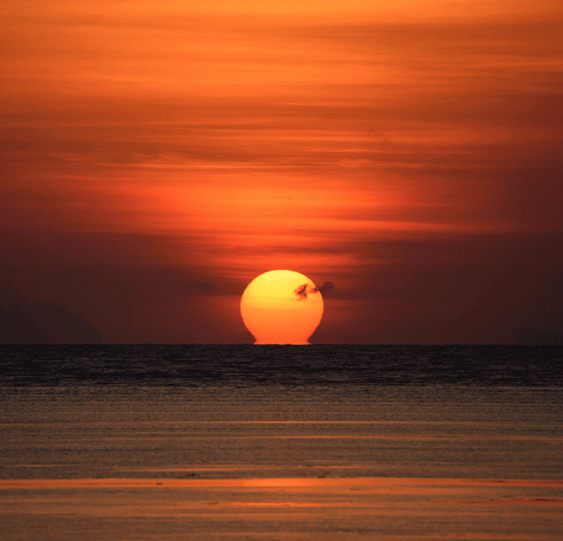 Amazing sunrise in phuket from the beach.