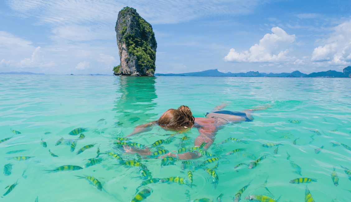 Swimming and snorkeling with the tropical fish around railay