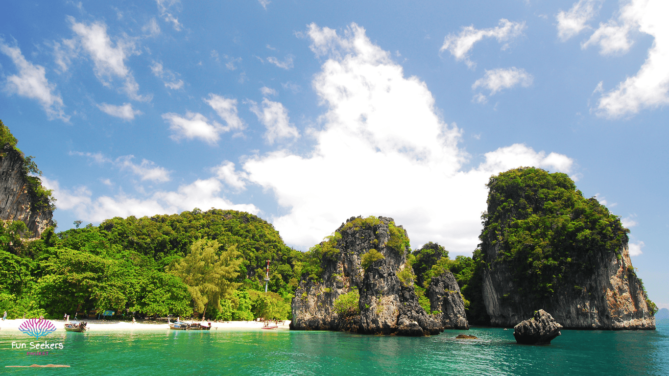 The hidden lagoon of hong island, surrounded by towering limestone cliffs.